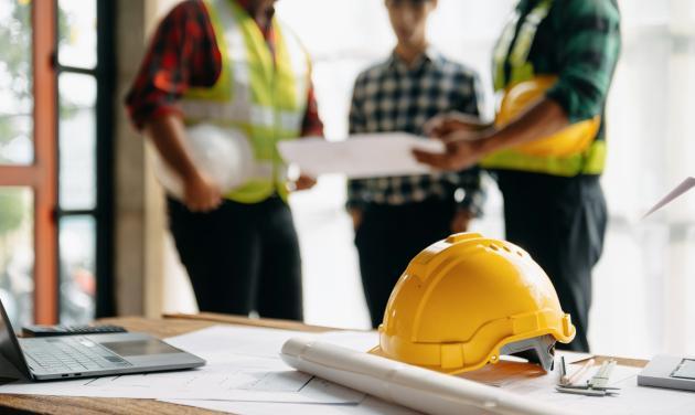 Three contractors talking to each other
